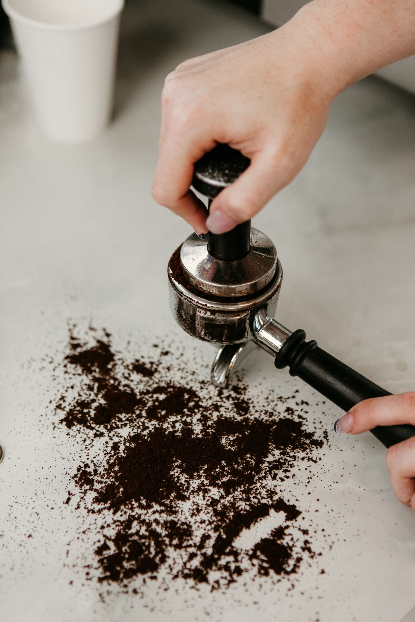 Pressing espresso grounds